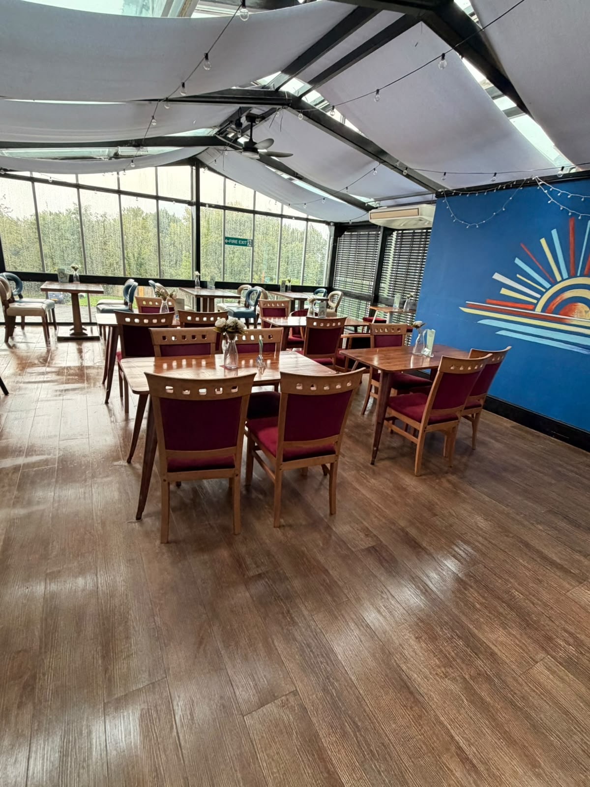 Clean event dining space with blue feature wall